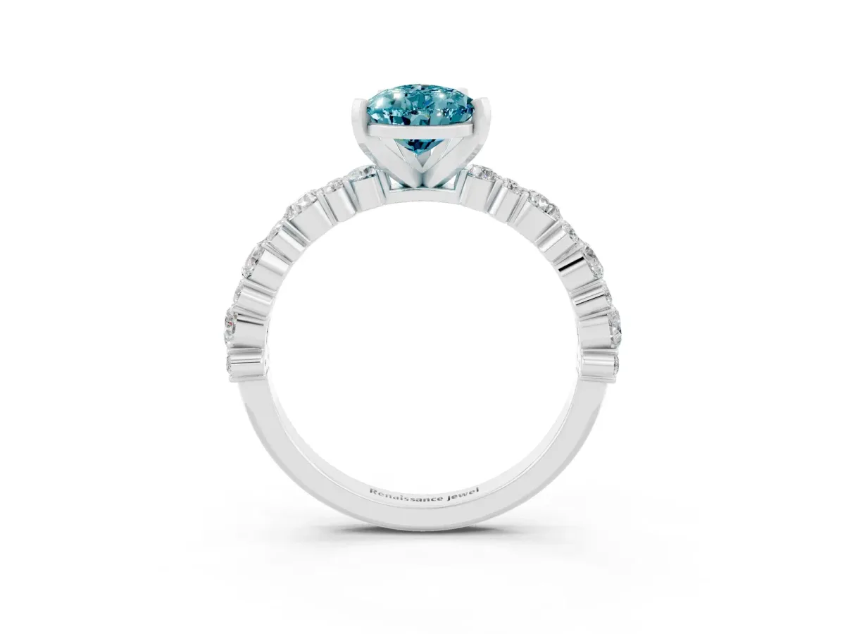 Pear Cut Blue Topaz Side Stone Solitaire Ring with Round and Four-Prong Setting Silver