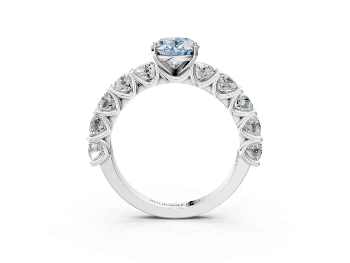 Fancy Blue Oval Cut Diamond Prong Setting with Side Stones on a Pave Band Platinum