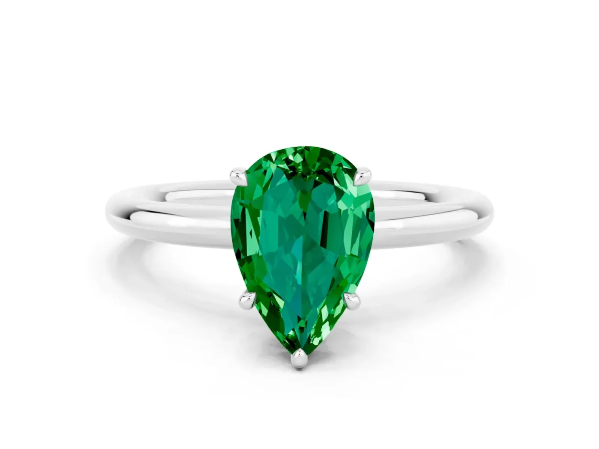 Pear Cut Emerald Solitaire Ring with Thin Band and Four-Prong Setting Silver