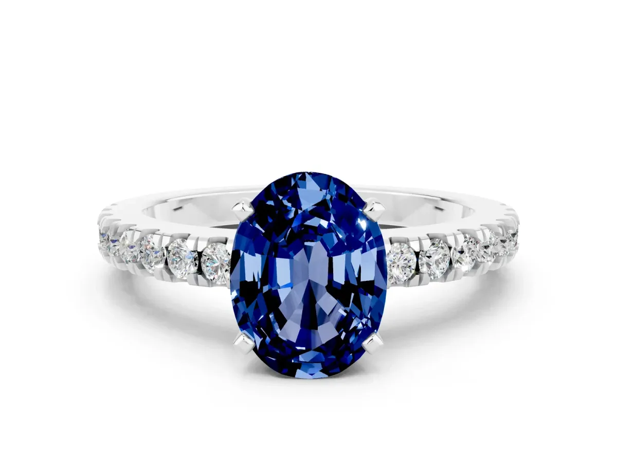 Oval Cut Solitaire Blue Sapphire with Pavé Band and Four-Prong Setting Silver