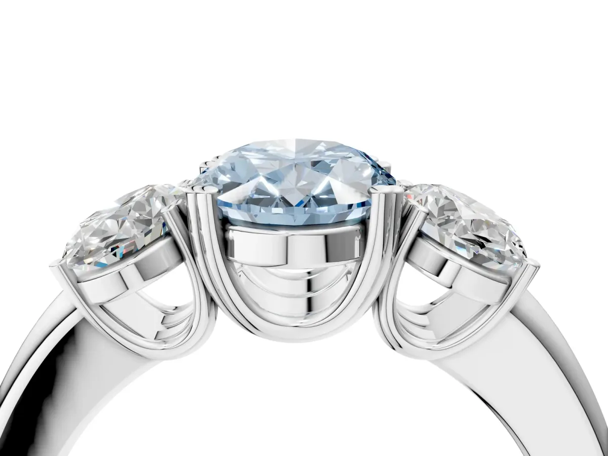 Fancy Blue Three-Stone Oval Cut Cut Diamond Ring with Channel Set Band and Four-Prong Setting Silver
