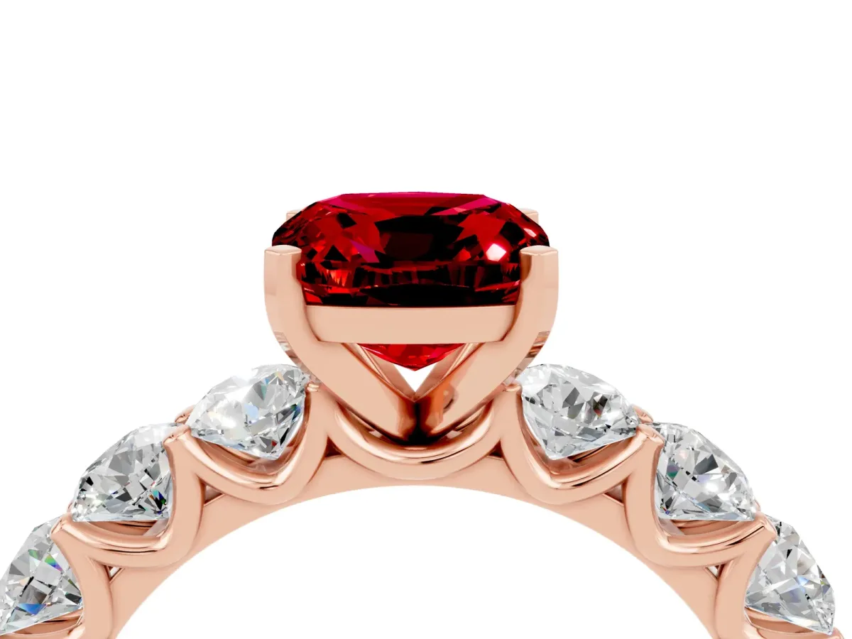 Cushion Cut Ruby Prong Setting with Side Stones on a Pave Band Rose gold