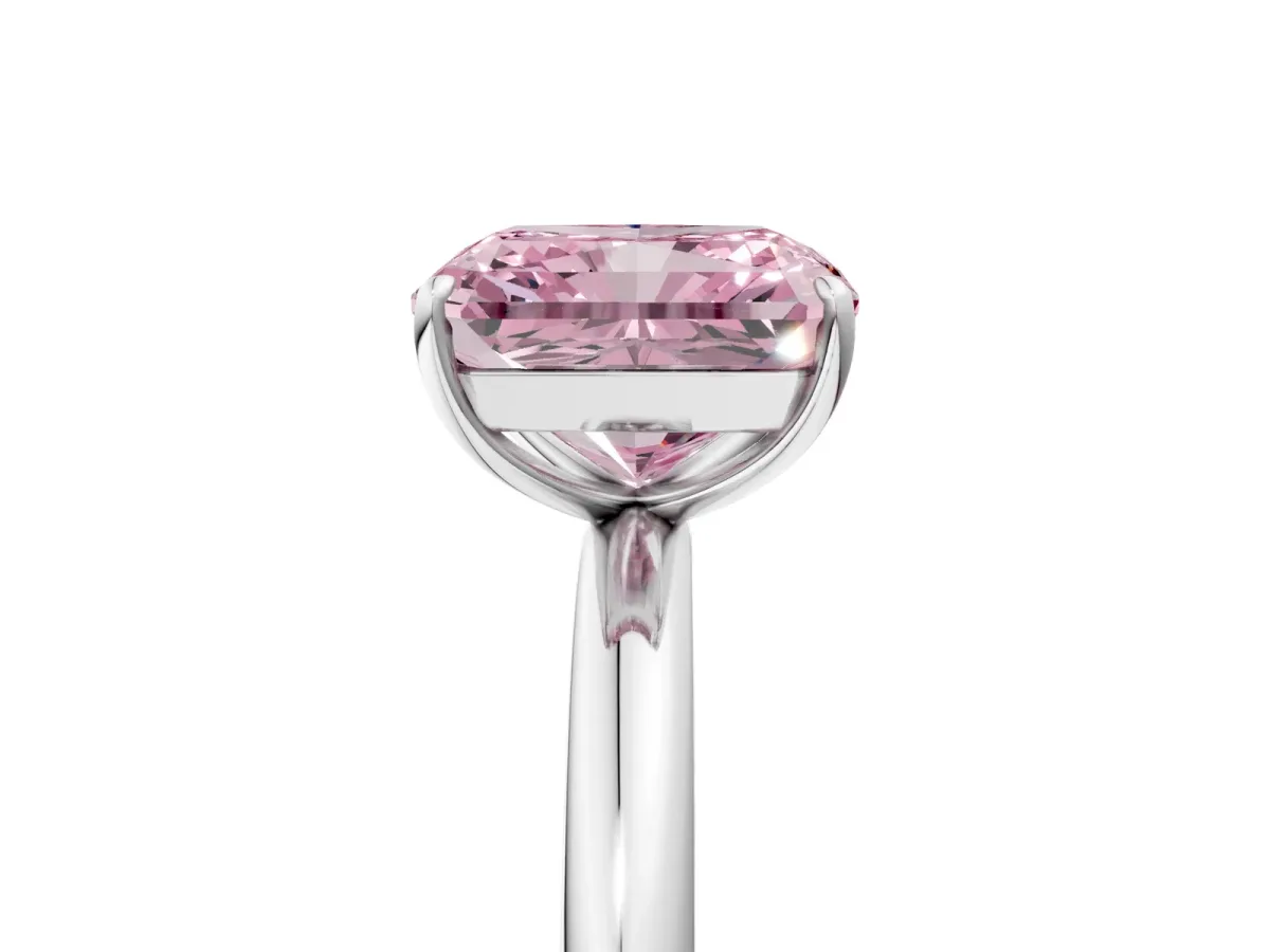 Fancy Pink Radiant Cut Solitaire Diamond Ring with Four-Prong Setting on a Plain Band Platinum