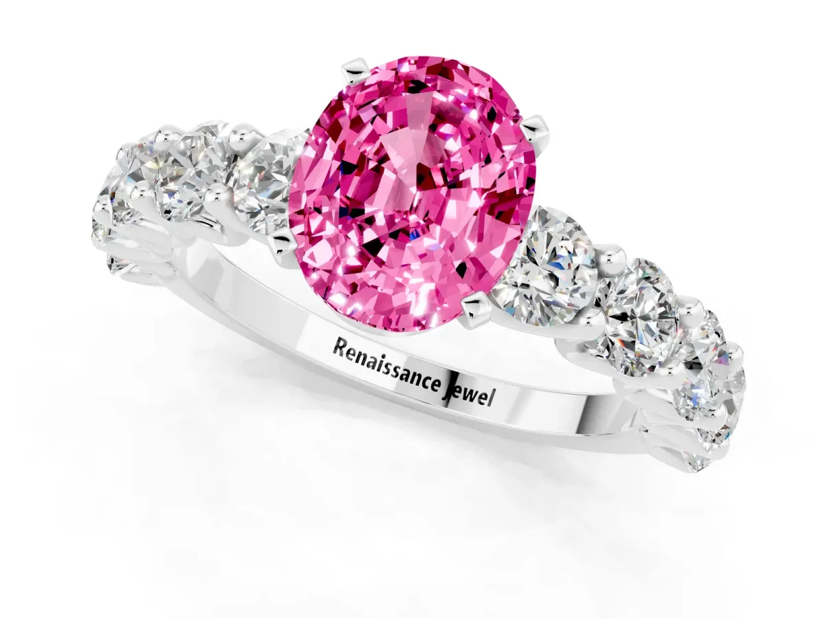 Oval Cut Pink Sapphire Prong Setting with Side Stones on a Pave Band Silver