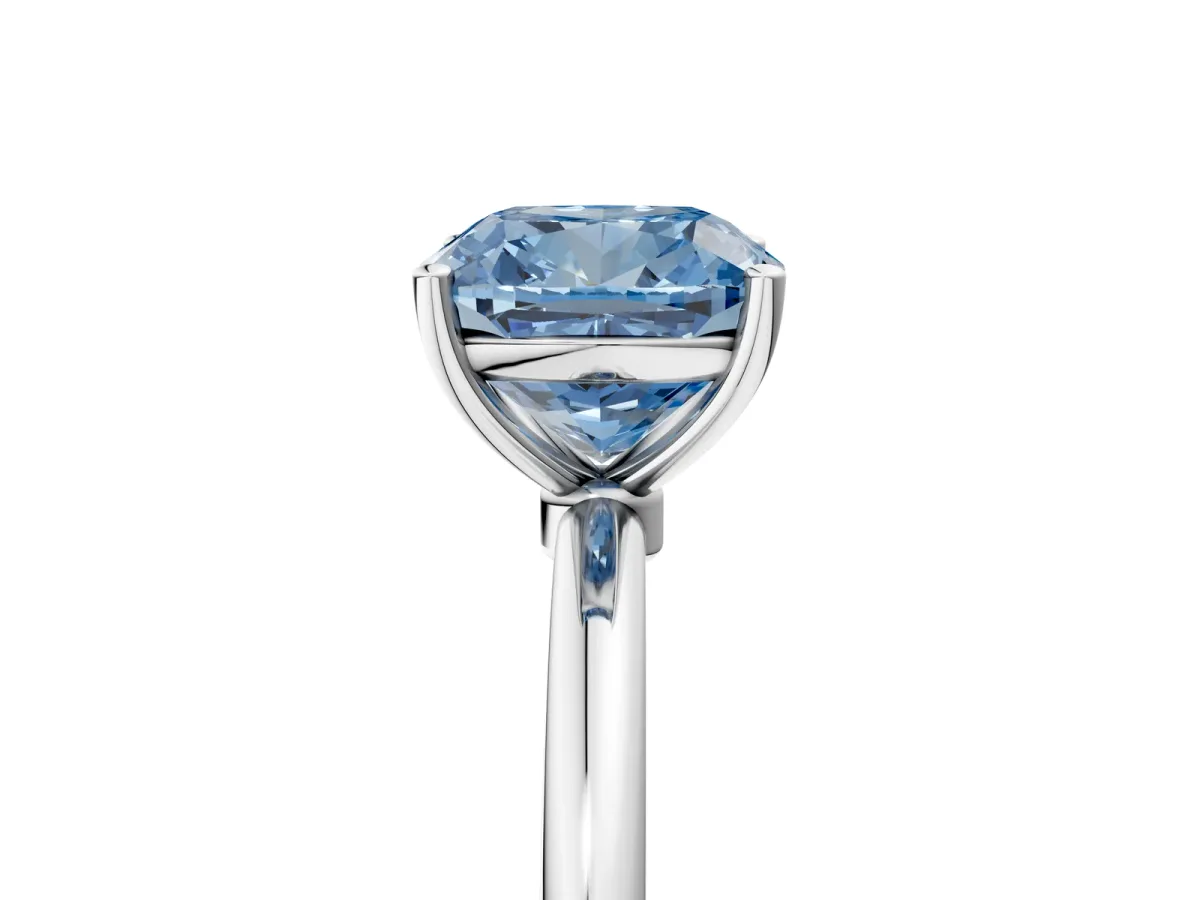 Fancy Blue Cushion Cut Cut Solitaire Engagement Ring with Thin Band and Four-Prong Setting Silver