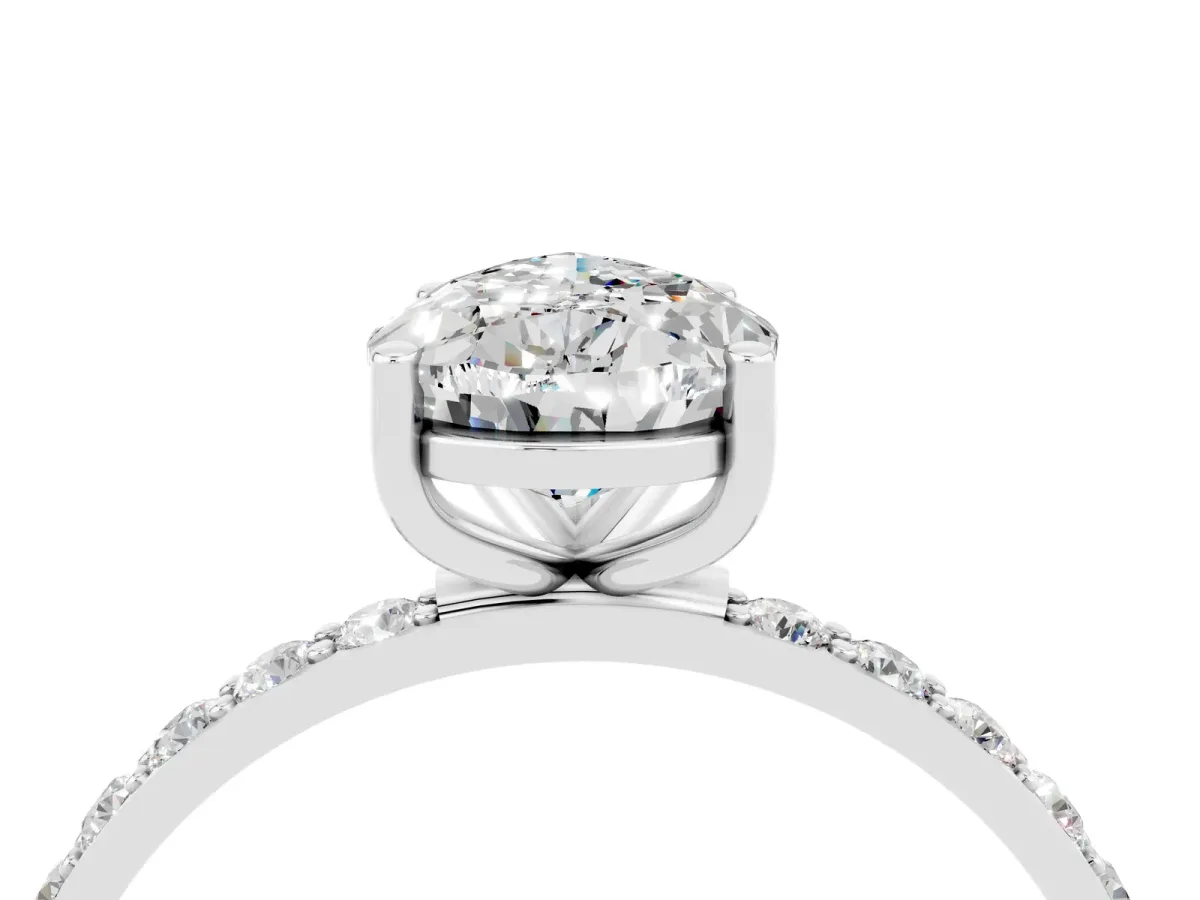 Pear Cut Moissanite Solitaire Ring with Round Pavé Band and Prong Setting Silver