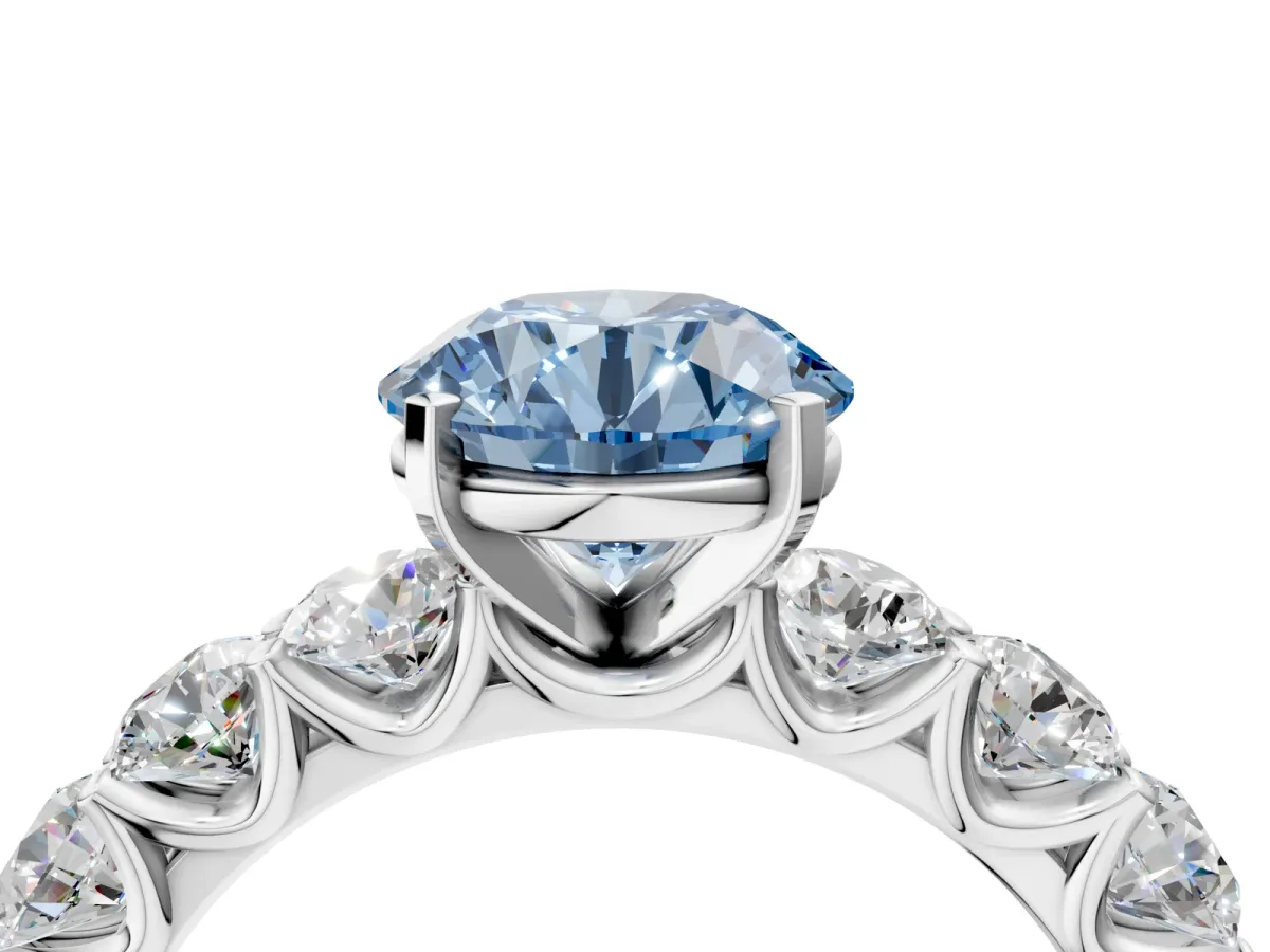 Fancy Blue Round Cut Diamond Prong Setting with Side Stones on a Pave Band Silver