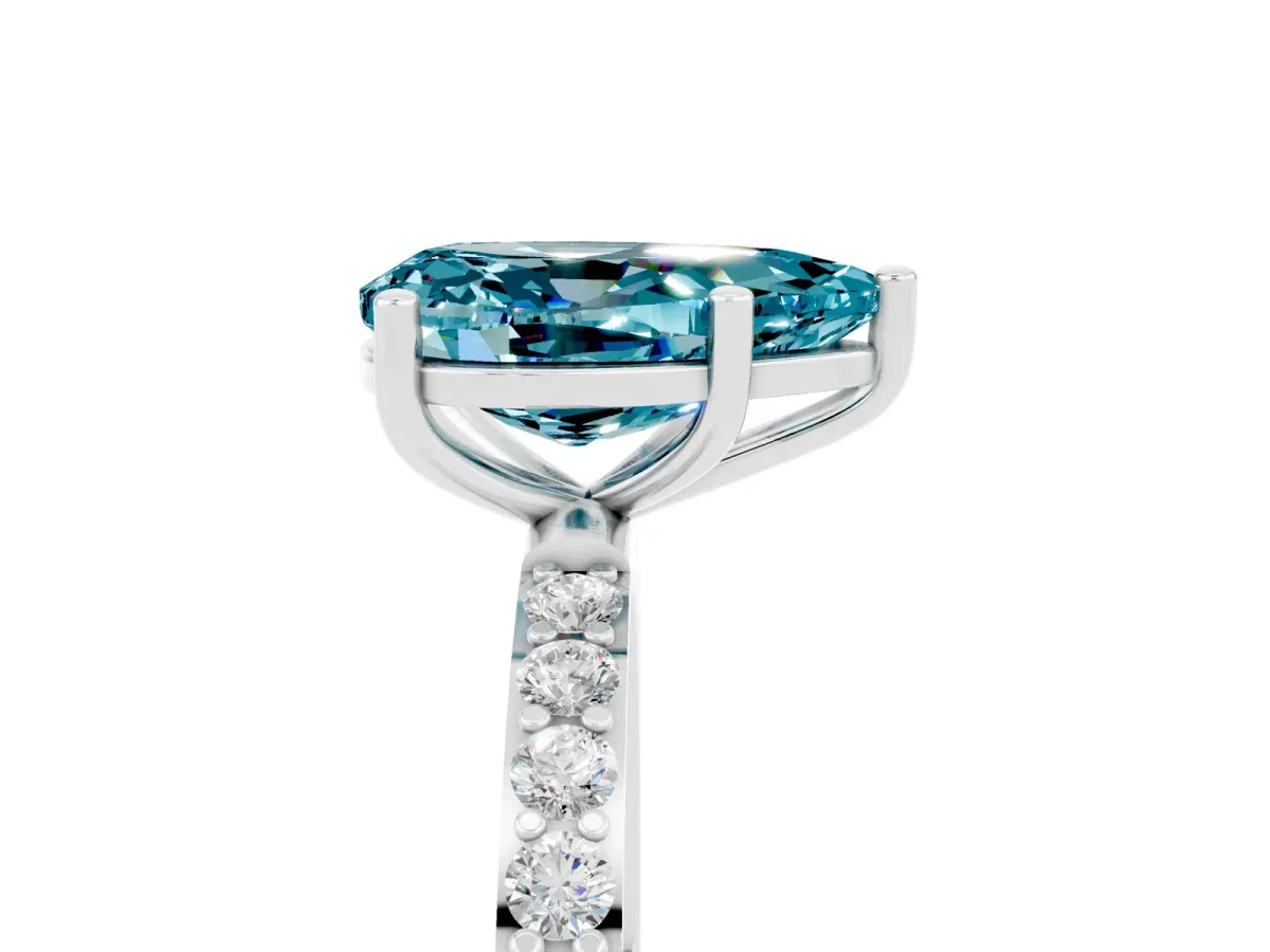 Pear Cut Blue Topaz Solitaire Ring with Round Pavé Band and Prong Setting Silver
