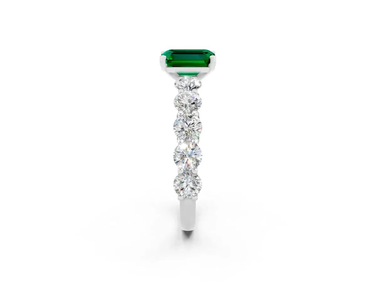 Emerald Cut Emerald Prong Setting with Side Stones on a Pave Band Platinum