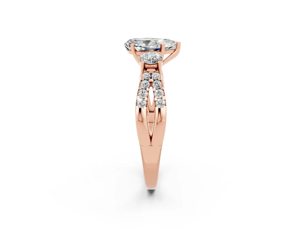 Pear Cut Moissanite Three-Stone Ring with Pavé Split Shank and Four-Prong Setting Rose gold