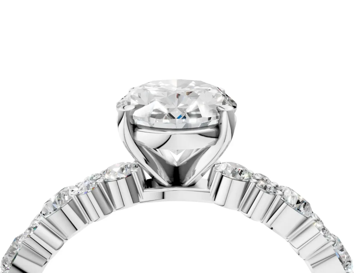 Oval Cut Diamond Side Stone Solitaire Ring with Round and Four-Prong Setting White gold