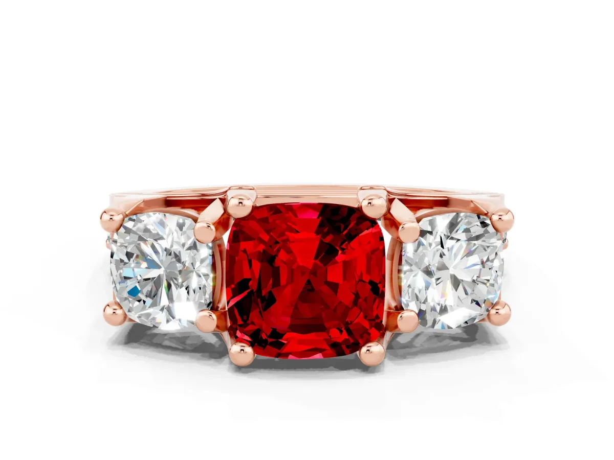 Cushion Cut Ruby Three-Stone Ring with Channel Set Band and Four-Prong Setting Rose gold