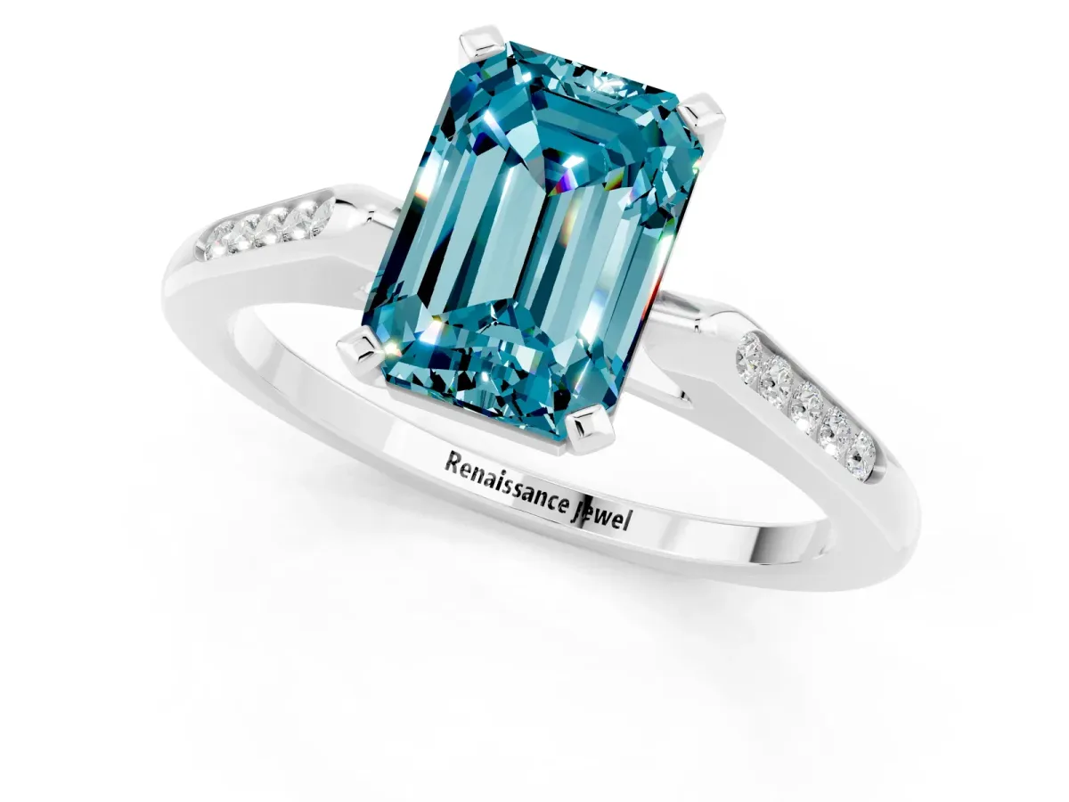 Emerald Cut Blue Topaz Solitaire Ring with Channel Set Round Band and Prong Setting Silver