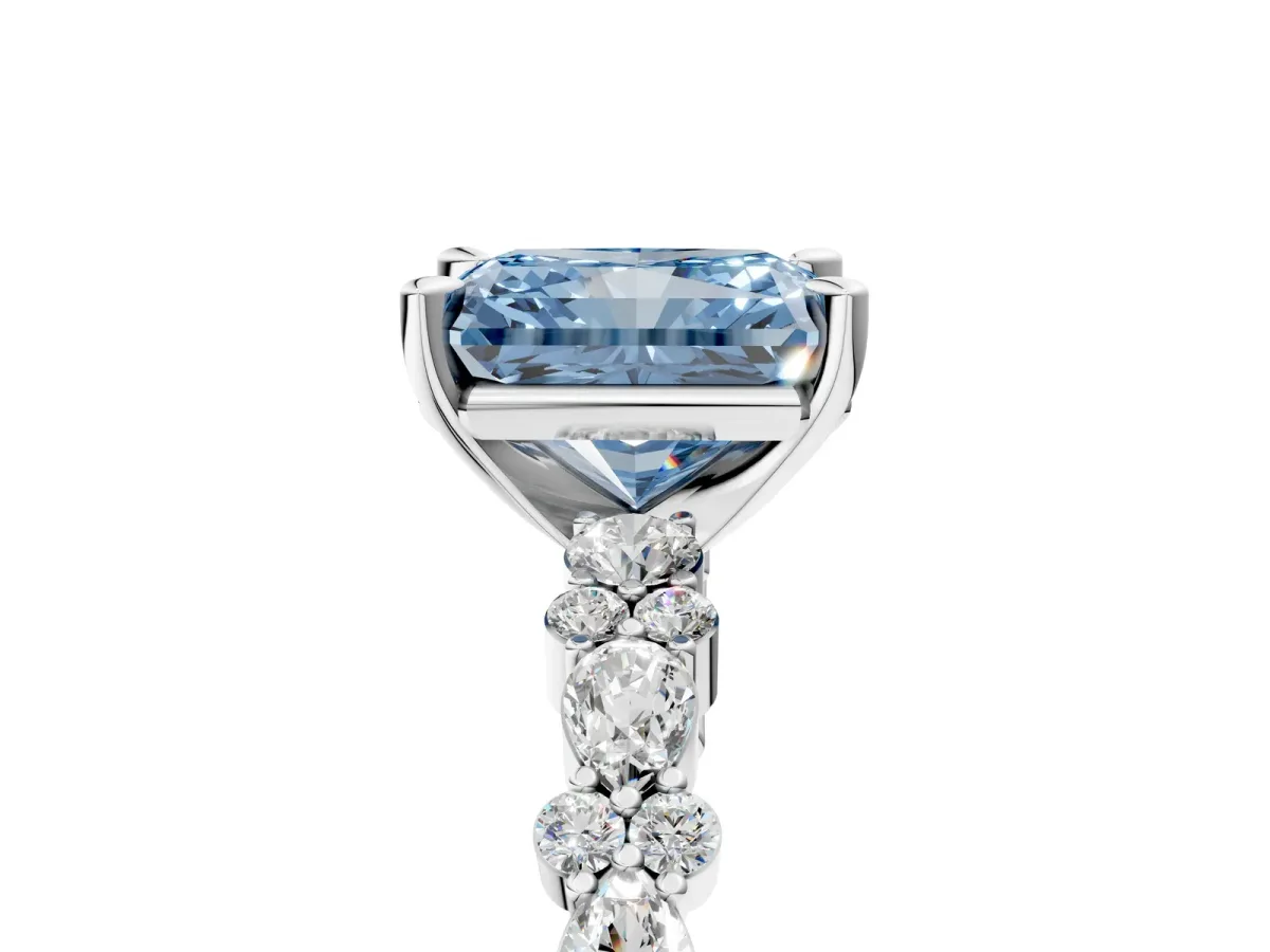 Fancy Blue Radiant Cut Diamond Side Stone Solitaire Ring with Round and Four-Prong Setting Platinum