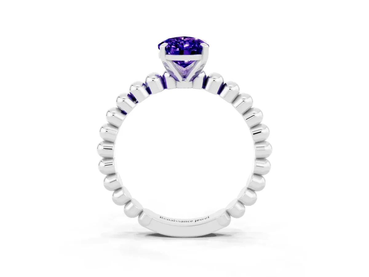 Pear Cut Tanzanite Solitaire Ring with Beaded Band and Prong Setting Silver