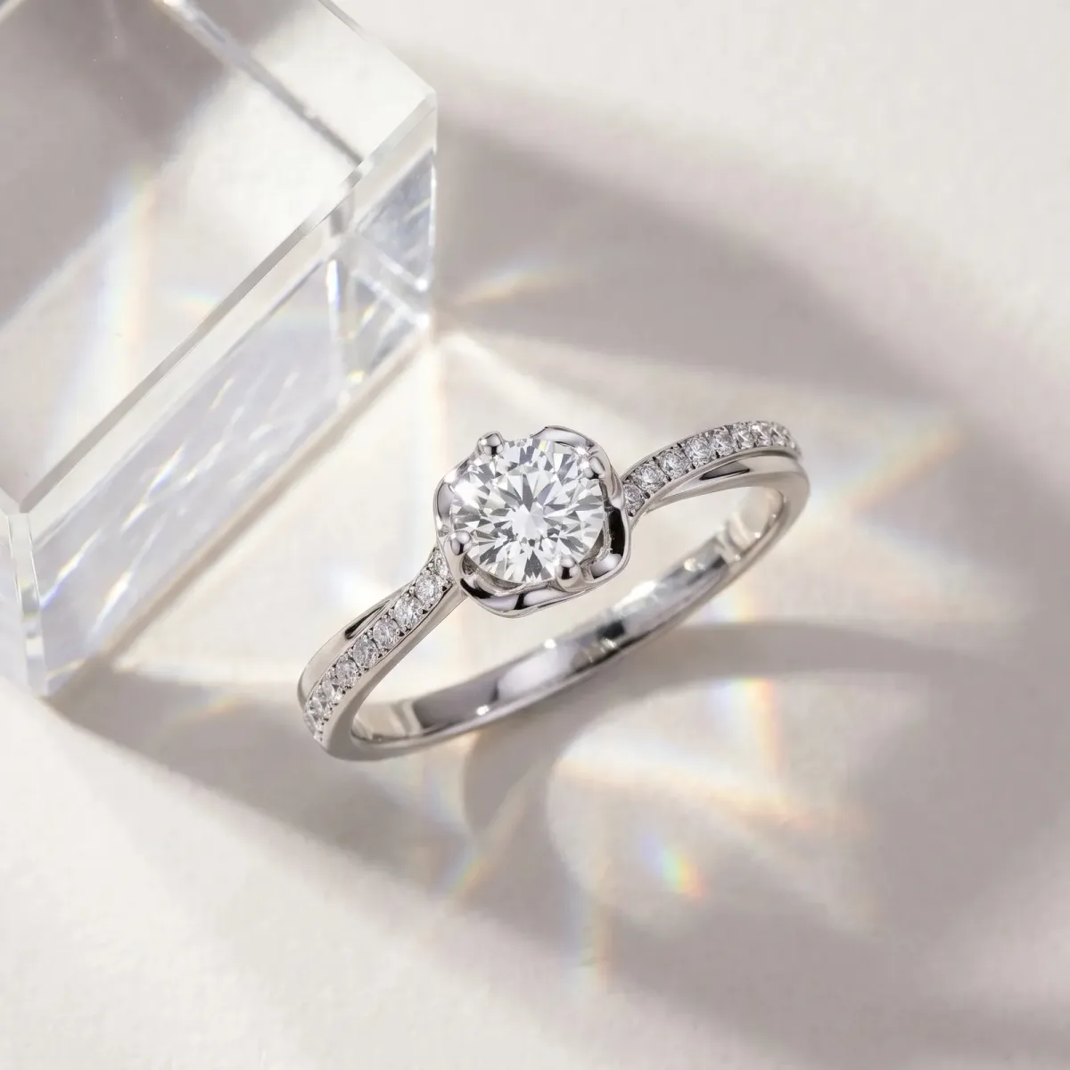 Round Cut Diamond Solitaire Ring with Pavé Band and Sculpted Prong Setting Silver