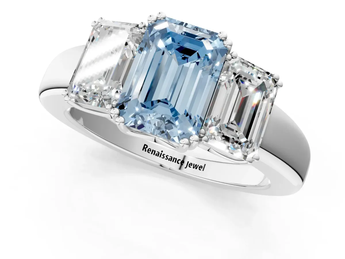 Fancy Blue Three-Stone Emerald Cut Cut Diamond Ring with Channel Set Band and Four-Prong Setting Silver