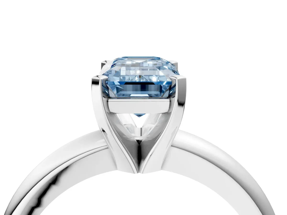 Fancy Blue Emerald Cut Diamond Solitaire Engagement Ring with Round Band and Four-Prong Setting Silver