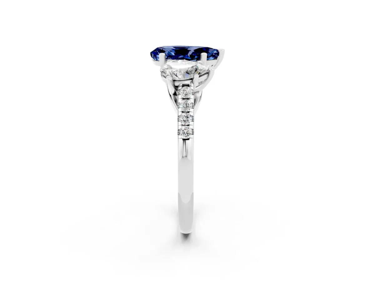 Three-Stone Pear Cut Blue Sapphire Ring with Round Pavé Band and Prong Setting Silver