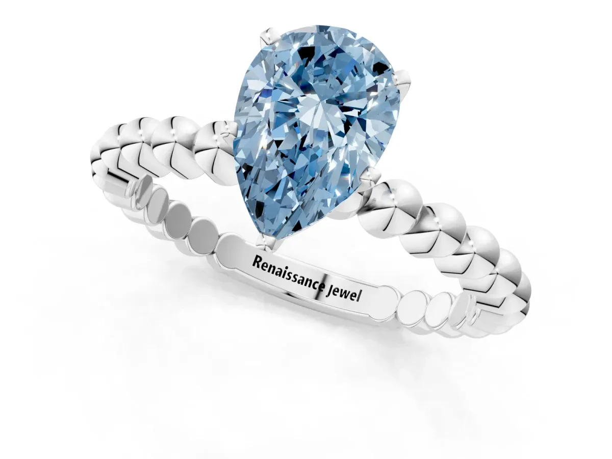 Fancy Blue Pear Cut Diamond Solitaire Ring with Beaded Band and Prong Setting Silver