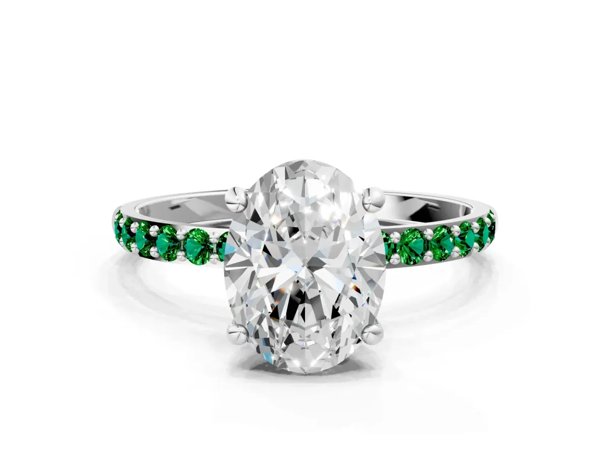 Oval Cut Diamond Solitaire Ring with Round Emerald Pavé Band and Prong Setting Silver