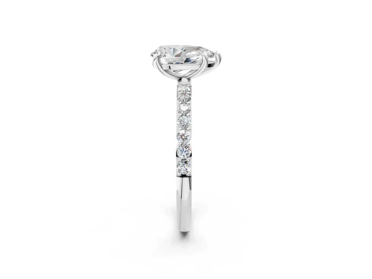 Pear Cut Diamond Solitaire Ring with Round Pavé Band and Prong Setting Platinum