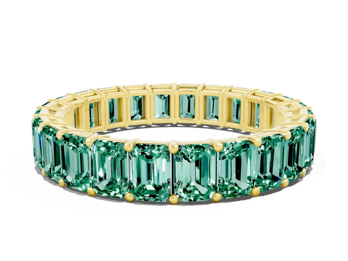 Emerald Cut Green Sapphire Eternity Band with Shared Prong Setting Yellow gold