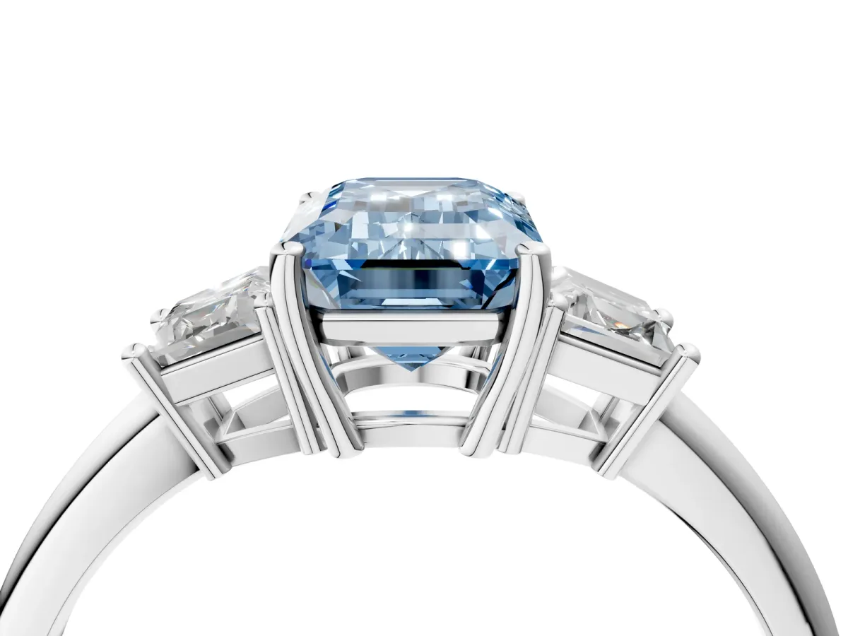 Fancy Blue Emerald Cut Diamond Three-Stone Ring with Trapezoid Side Stones and Prong Setting Silver
