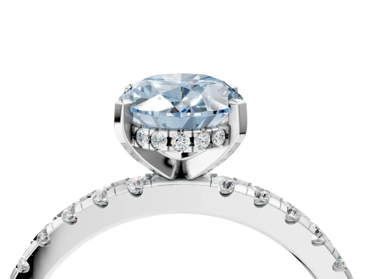 Fancy Blue Oval Cut Diamond Solitaire Ring with Round Pavé Band and Four-Prong Setting Silver