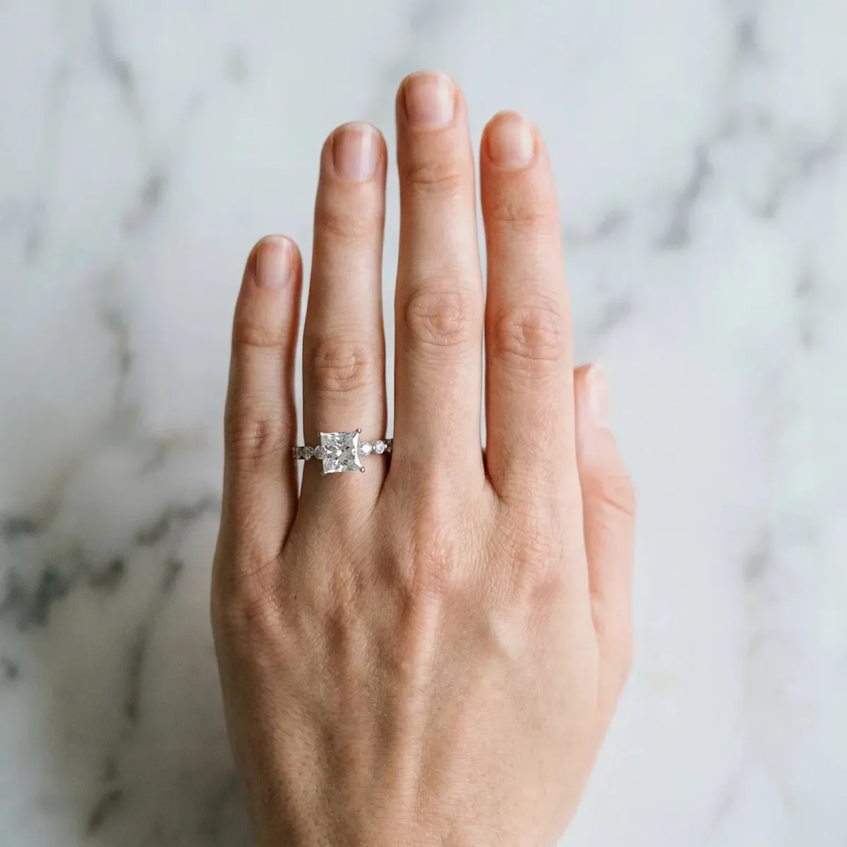 Princess Cut Solitaire Diamond Ring with Pave Band and Four-Prong Setting Platinum