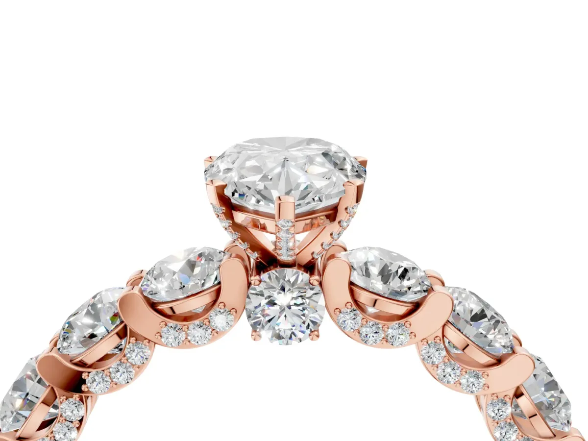 Pear Cut Diamond Side Stone Engagement Ring with Four-Prong Setting Rose gold