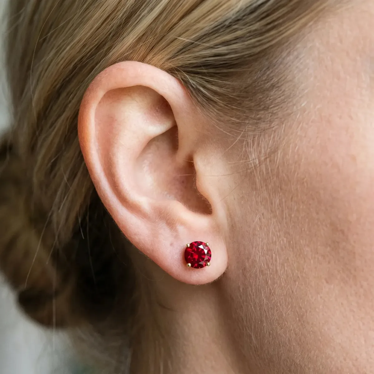 Round Cut Ruby Stud Earrings Yellow gold