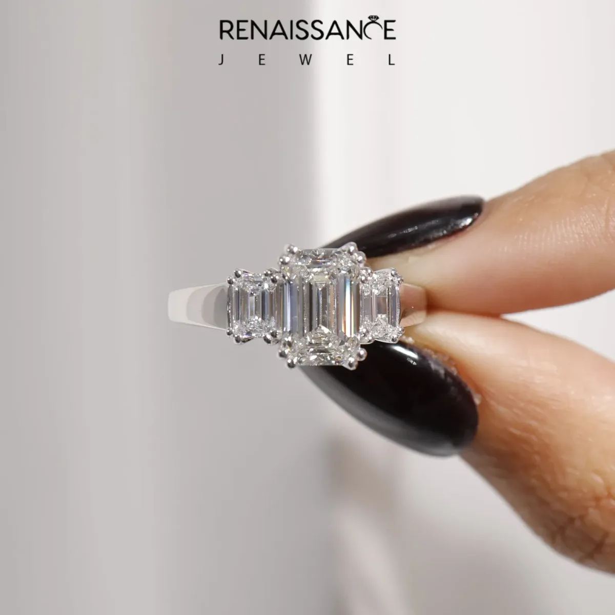 Three-Stone Oval Cut Cut Diamond Ring with Channel Set Band and Four-Prong Setting Silver
