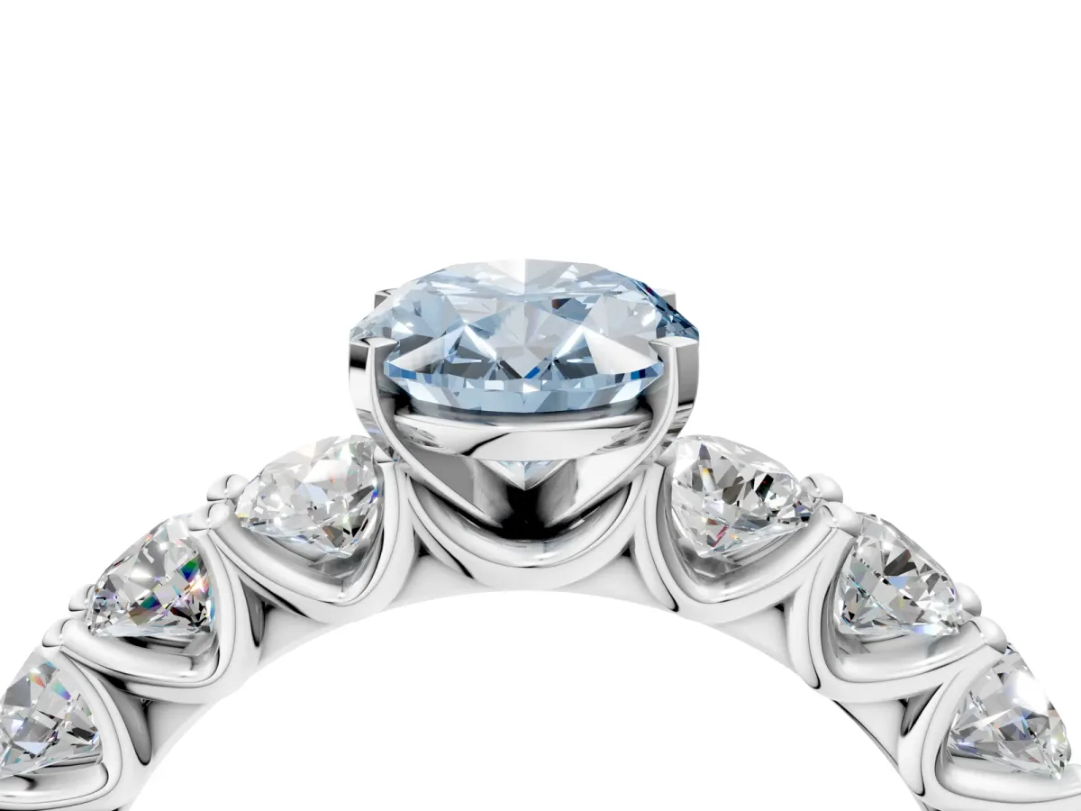 Fancy Blue Oval Cut Diamond Prong Setting with Side Stones on a Pave Band Platinum