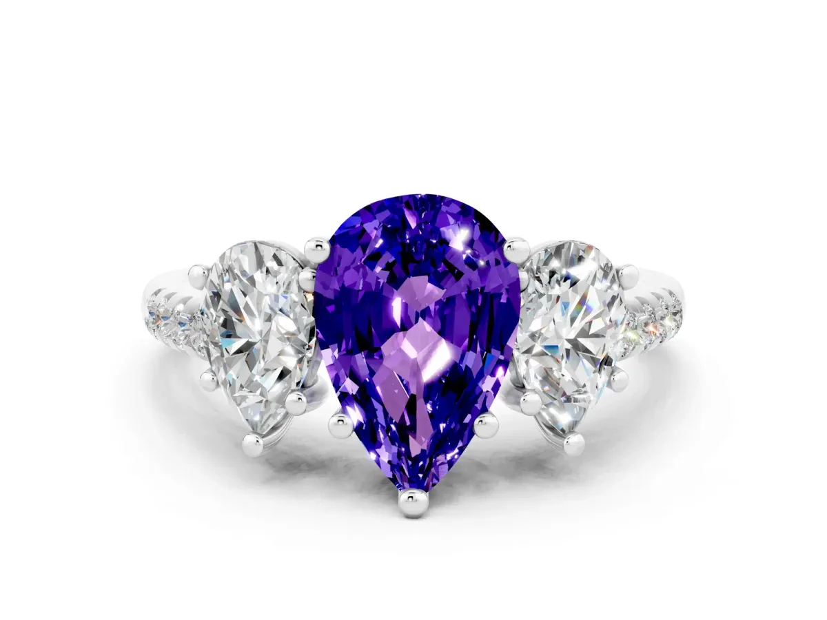 Three-Stone Pear Cut Tanzanite Ring with Round Pavé Band and Prong Setting Platinum