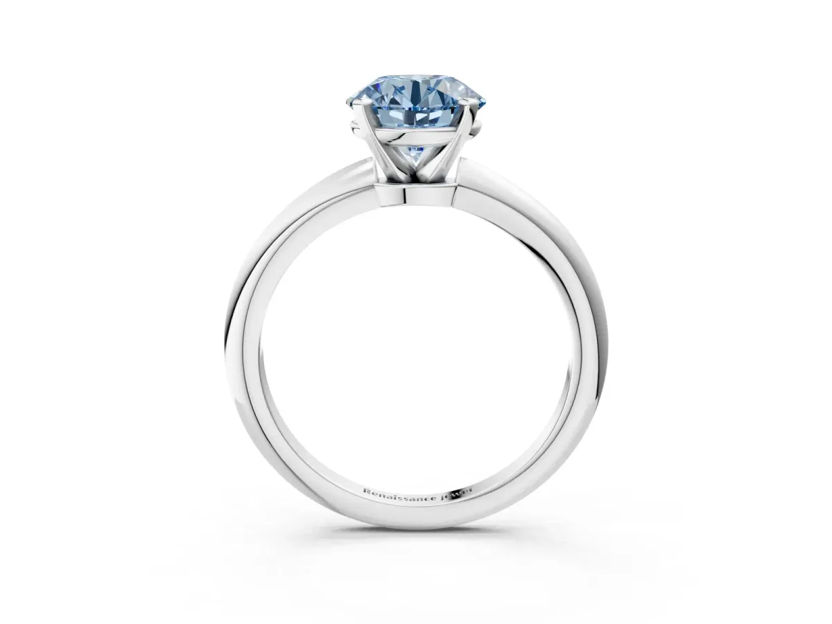 Fancy Blue Round Cut Diamond Solitaire Ring with Six-Prong Setting and Classic Band Silver
