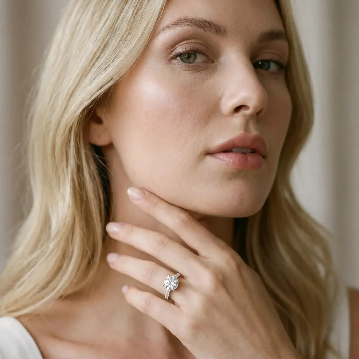 Round Cut Diamond Solitaire Engagement Ring with Pavé Band and Four-Prong Setting Silver
