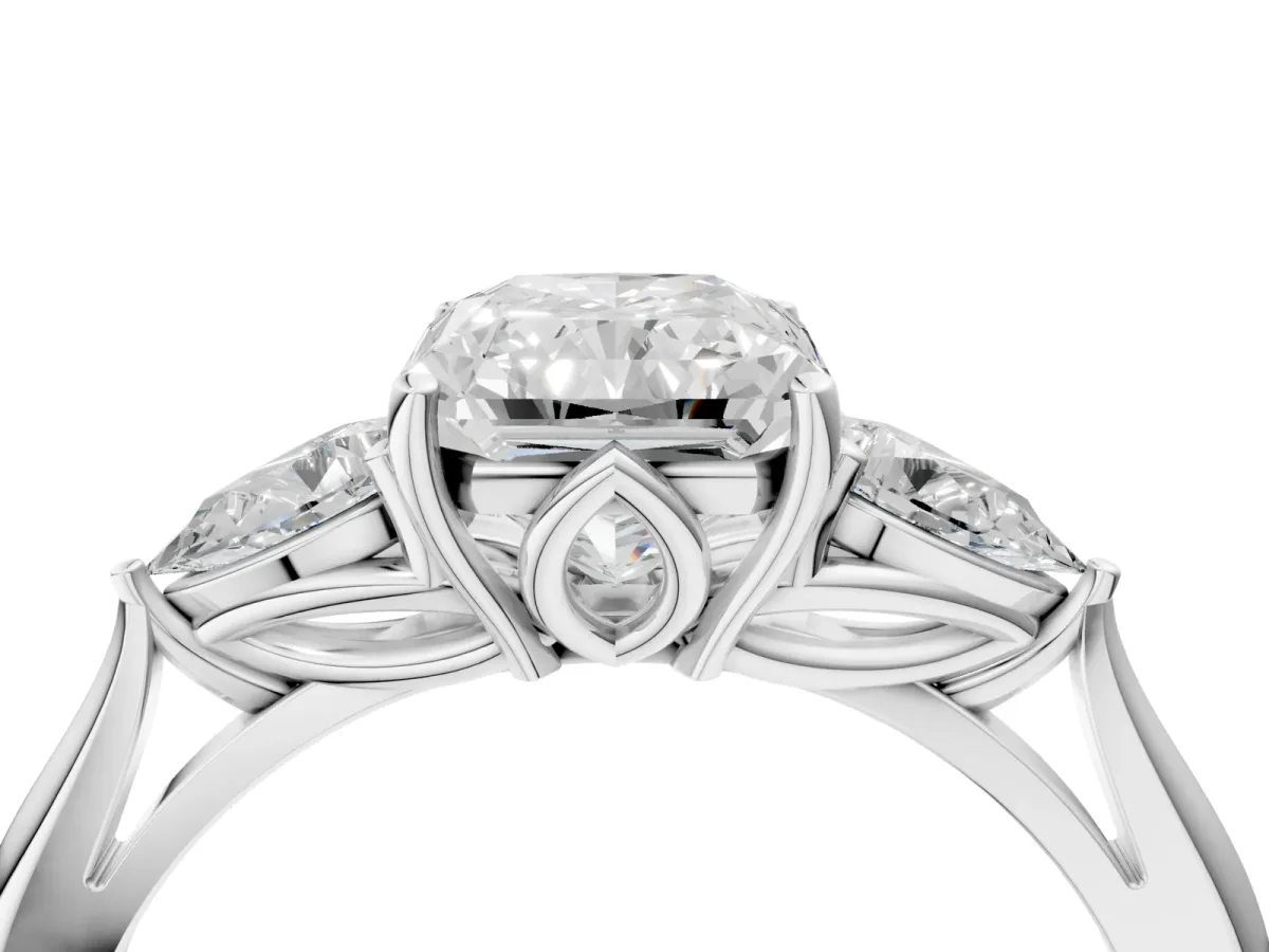 Three-Stone Radiant Cut Diamond Ring with Pear Side Stones in Four-Prong Setting Platinum