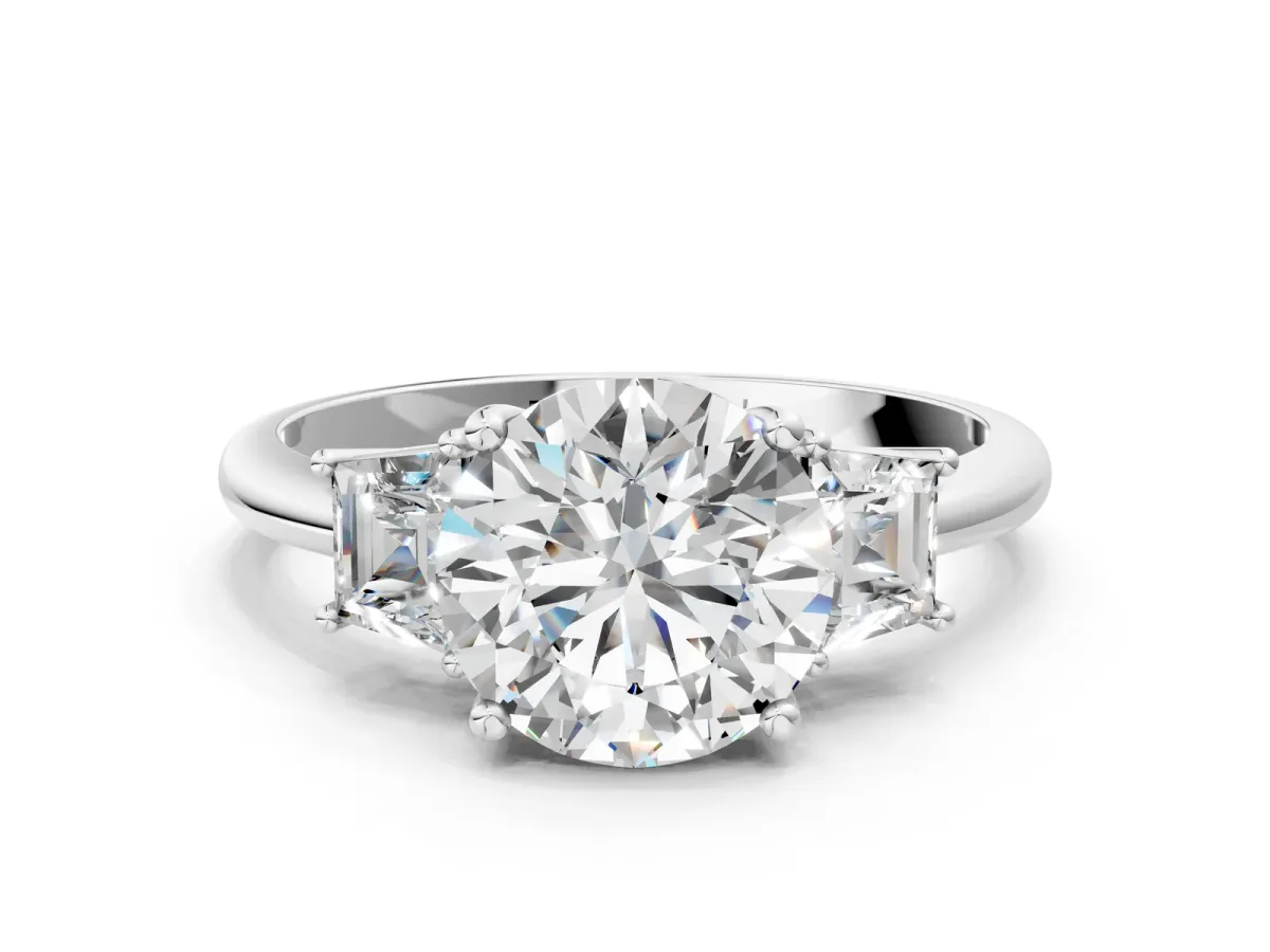 Round Cut Diamond Three-Stone Ring with Trapezoid Side Stones and Prong Setting Platinum