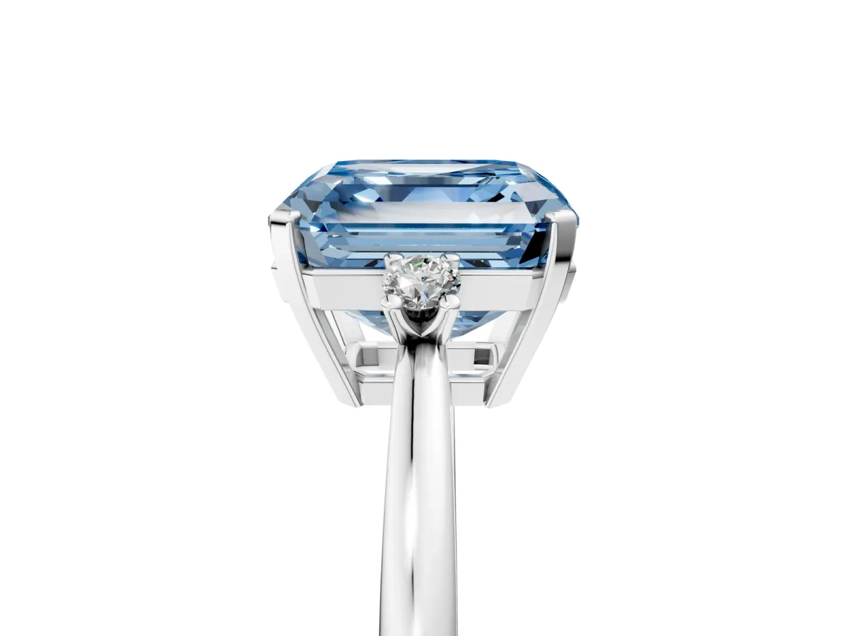 Fancy Blue Asscher Cut Cut Three-Stone Solitaire Ring with Round Accent Diamonds and Four-Prong Setting Platinum