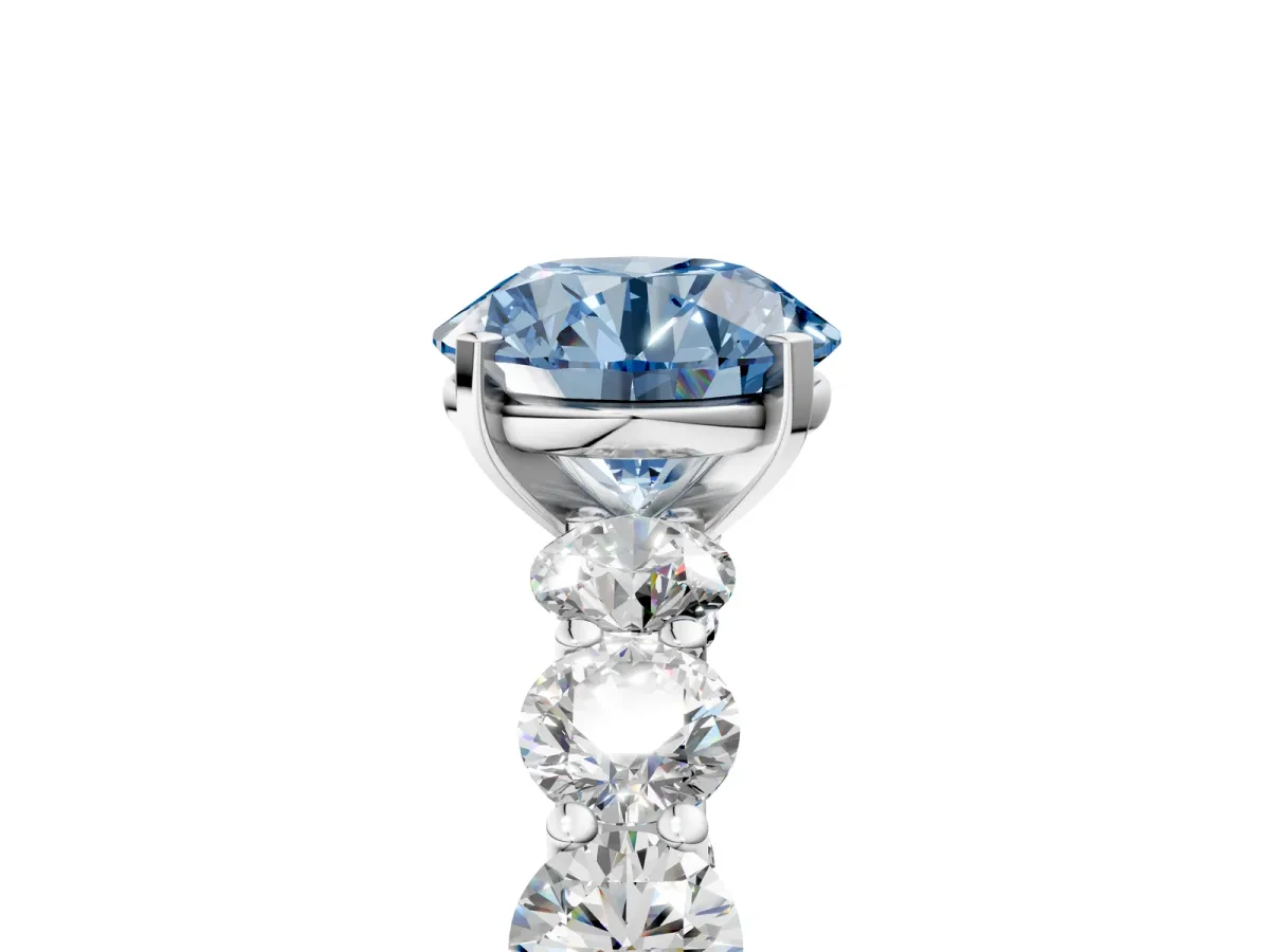 Fancy Blue Round Cut Diamond Prong Setting with Side Stones on a Pave Band Silver