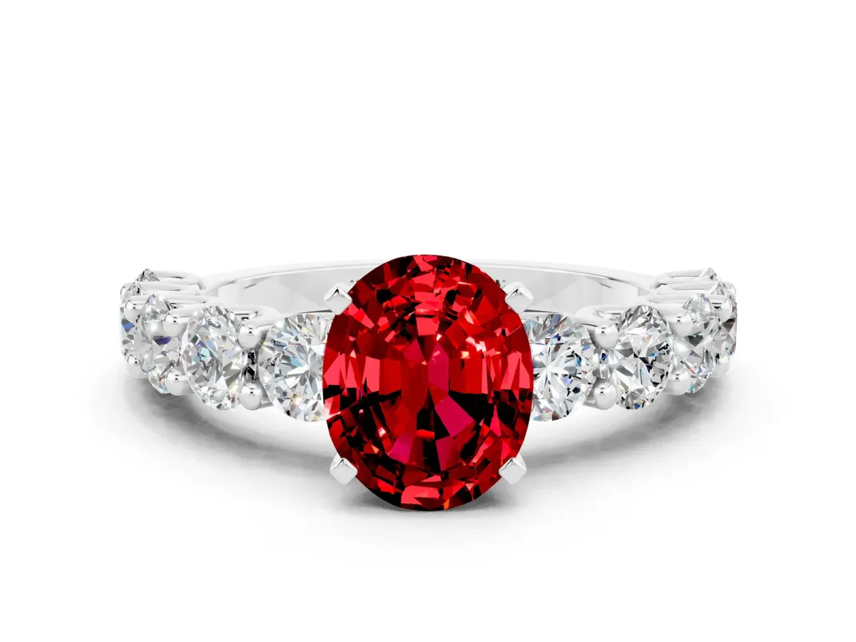Oval Cut Ruby Prong Setting with Side Stones on a Pave Band Platinum