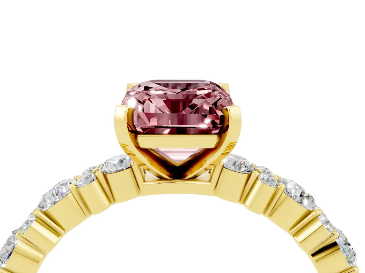 Emerald Cut Morganite Side Stone Solitaire Ring with Round and Four-Prong Setting Yellow gold