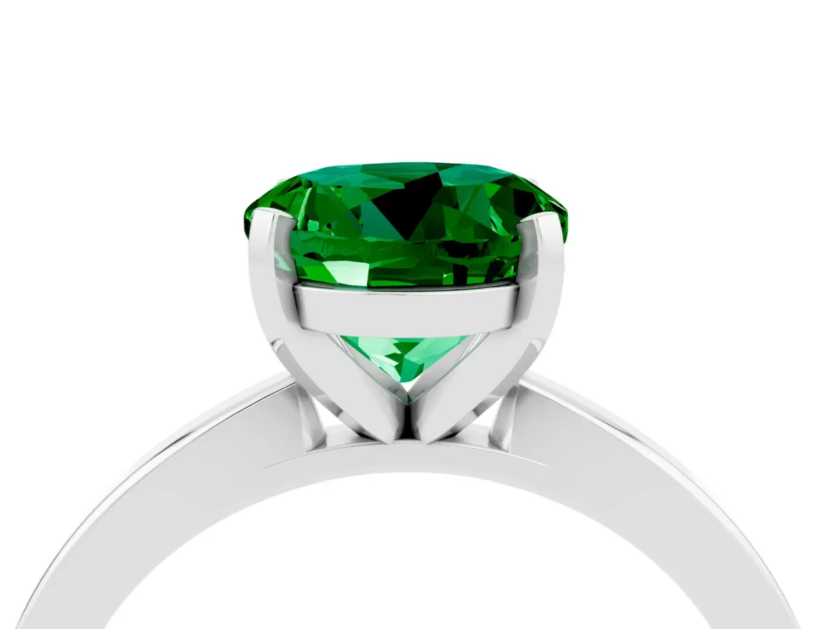 Round Cut Emerald Solitaire Engagement Ring with Classic Band and Four-Prong Setting Silver