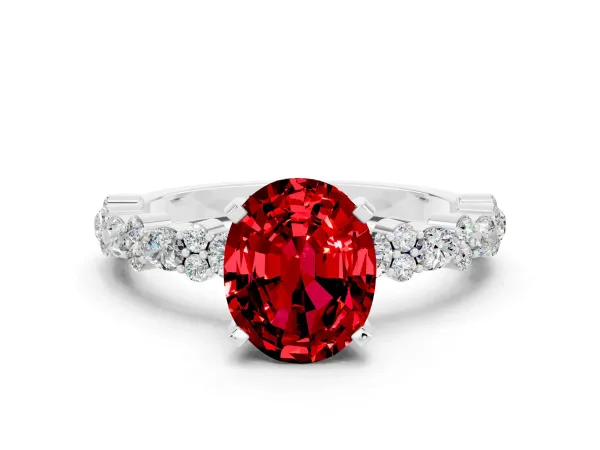 Oval Cut Ruby Side Stone Solitaire Ring with Round and Four-Prong Setting White gold