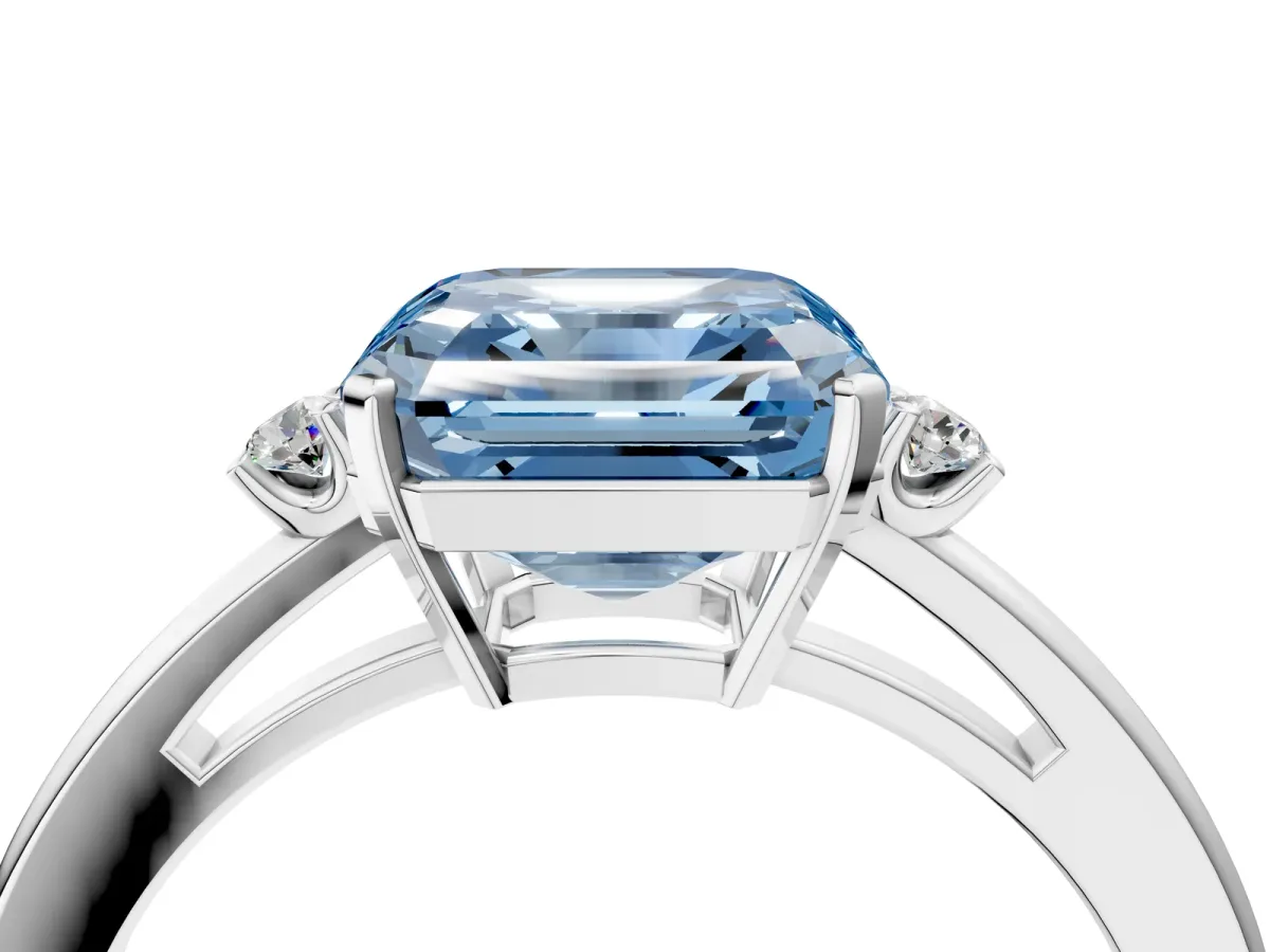 Fancy Blue Asscher Cut Cut Three-Stone Solitaire Ring with Round Accent Diamonds and Four-Prong Setting Platinum