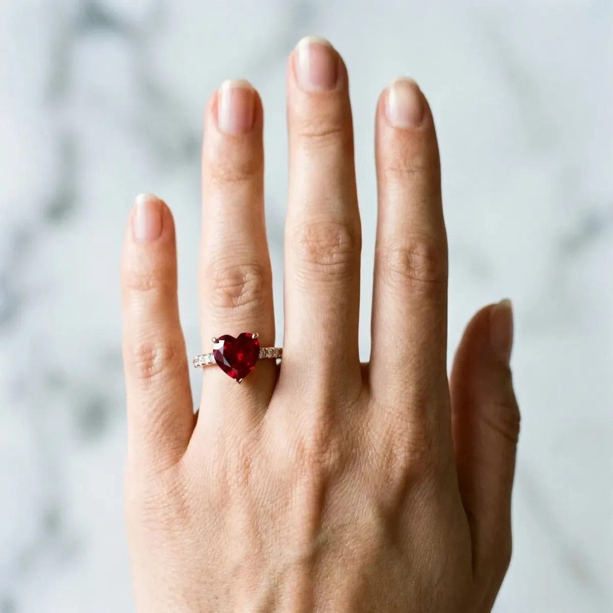 Heart Cut Ruby Solitaire Ring with Round Pavé Band and Four-Prong Setting Rose gold