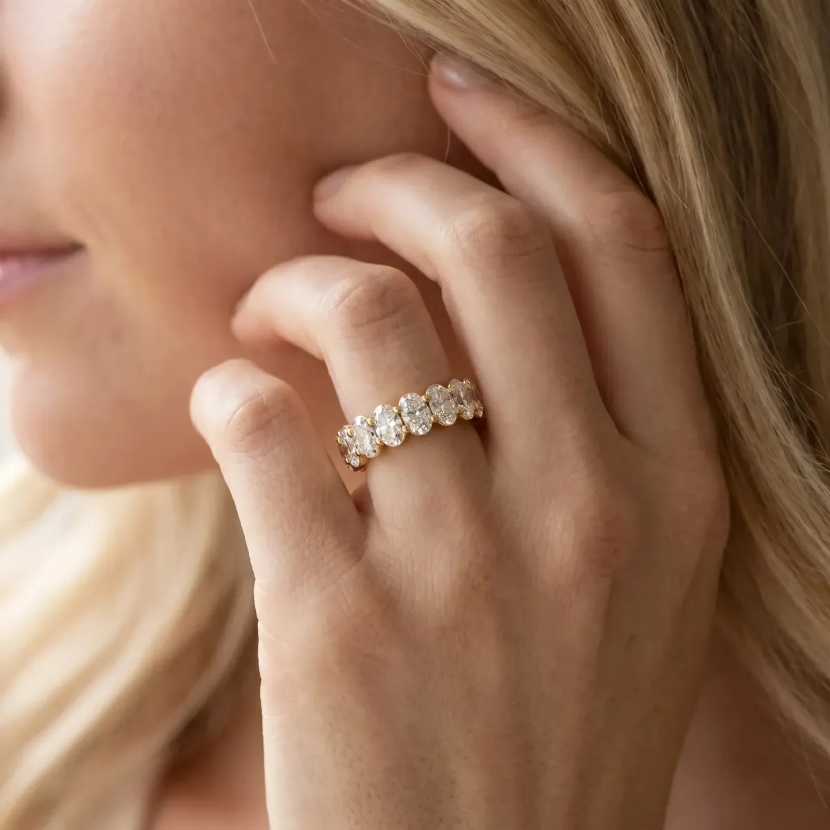 Oval Cut Diamond Eternity Band with Shared Prong Setting Yellow gold