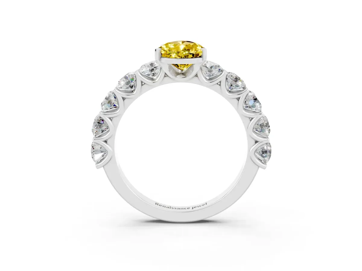 Pear Cut Yellow Sapphire Prong Setting with Side Stones on a Pave Band Silver
