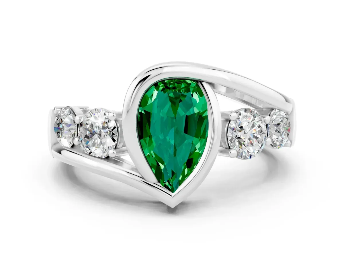 Bezel Set Pear Cut Emerald Bypass Ring with Round Accents Platinum